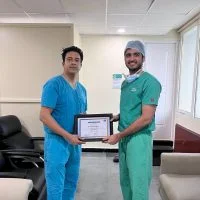 Dr. Diper Ariwala receiving a certificate